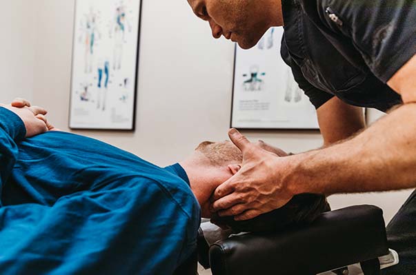 Chiropractor Portland OR Dr. Daniel Capitano Adjusting Patient Chiropractor Portland OR Dr. Daniel Capitano Adjusting Patient